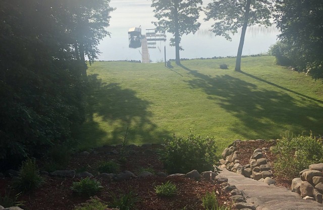 Mission Lake home with dock and sandy bottom