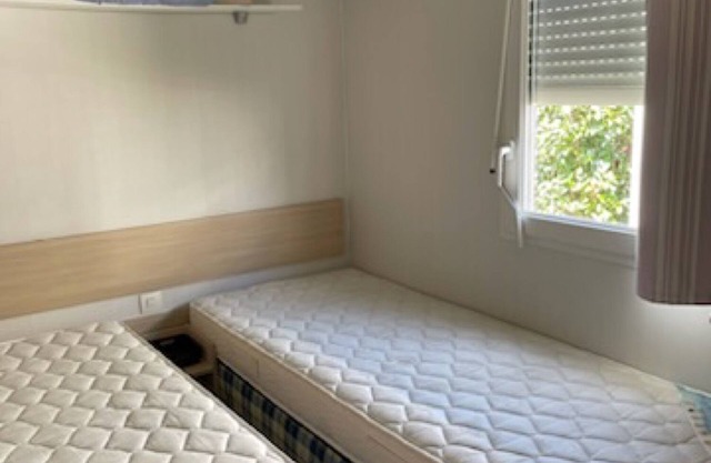 Mobil-home 'Mobil-home Kapa - Proche Mer' con piscina compartida, terraza privada y jardín privado
