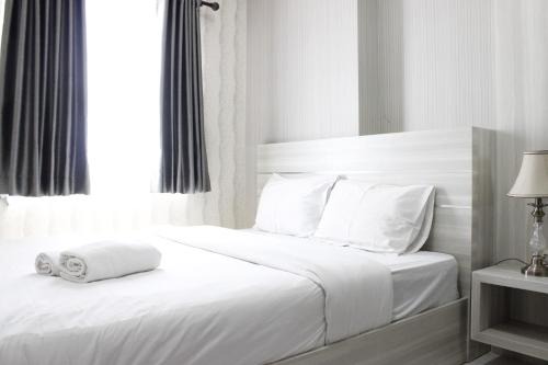 Modern 2BR Apartment at Mekarwangi Square Cibaduyut By Travelio