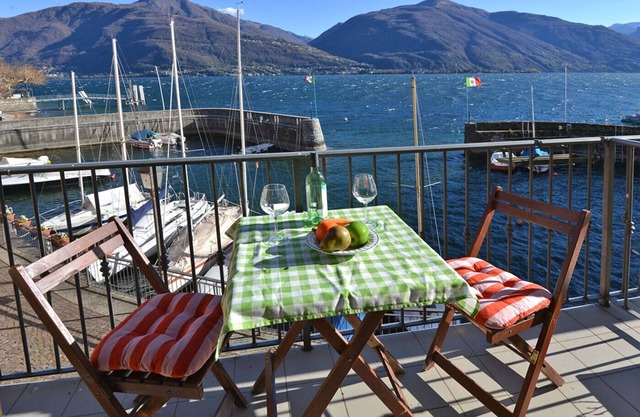 Modern apartment with balcony and lake view, located directly on Lake Como
