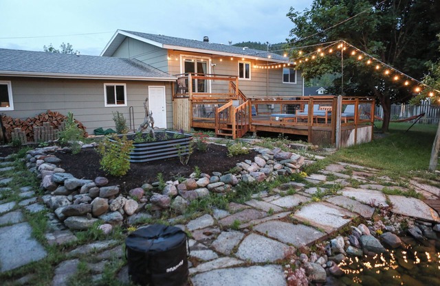 Modern dog-friendly retreat, with large deck, gardens, pond, and trails.