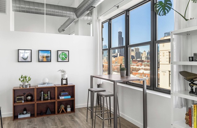 Modern Historic Loft 19ft Ceilings, Gym, Heated Parking, Skyline Views + Balcony