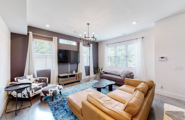 Modern home in a great location with fenced yard, patio, grill, AC, & W/D