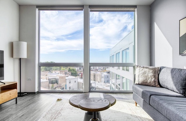 Modern Logan Square 1BR w/ Roof Deck & Gym, 1 block to L, by Blueground