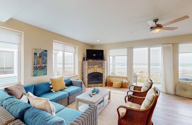 Modern oceanfront home with private hot tub, patio, & gas fireplace