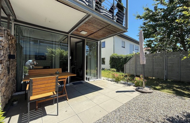 Modern See und Mehr Apartment 3 with covered terrace and garden view