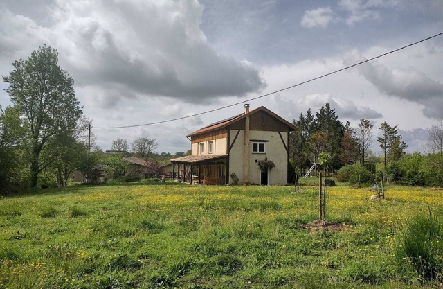 Modern spacious barn conversion surrounded by nature with shared swimming pool