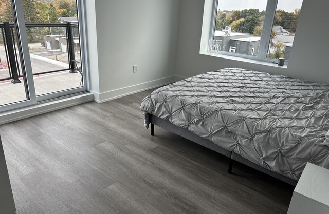 Modern, spacious two bedroom condo with a lake view from windows and balcony