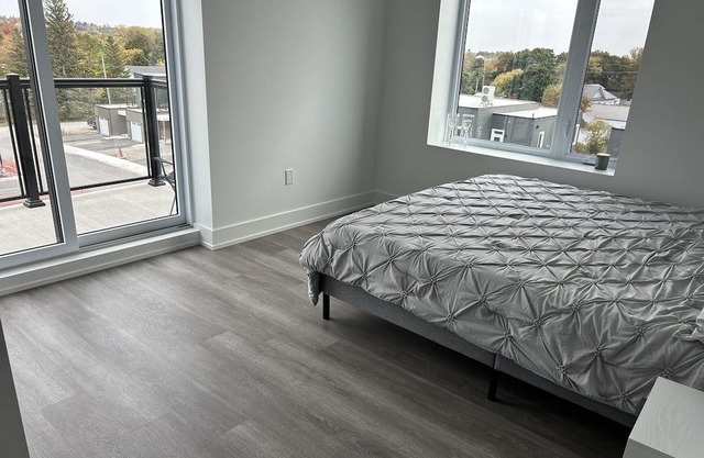 Modern, spacious two bedroom condo with a lake view from windows and balcony