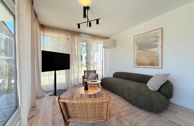 Modern Suite Happiness with covered terrace near the lake and beach in Uhldinge