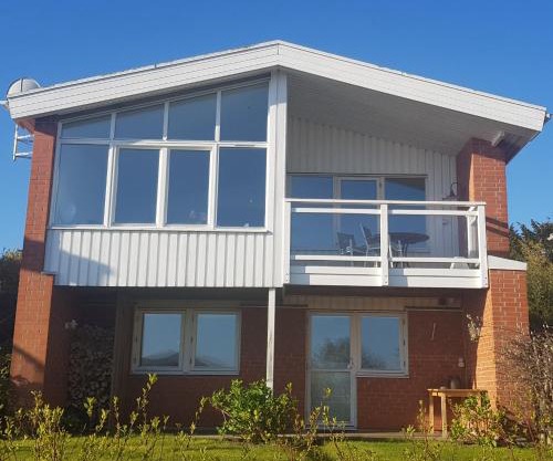 Modern villa i Arild med spektakulär havsutsikt.
