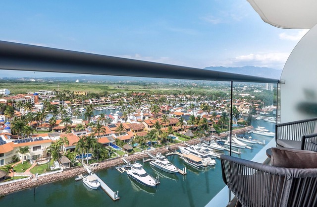 Modern, water & mountain view condo with huge balcony, rooftop pool, gym, & spa