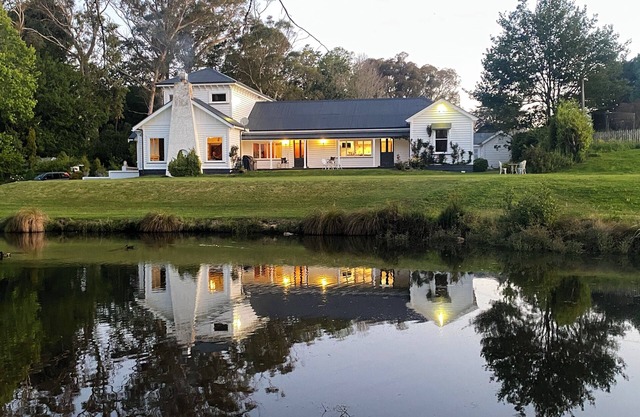 Modernized country house set in beautiful gardens with swimming pool.