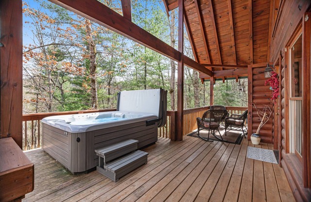 Mountain cabin with private hot tub, covered deck & incredible view