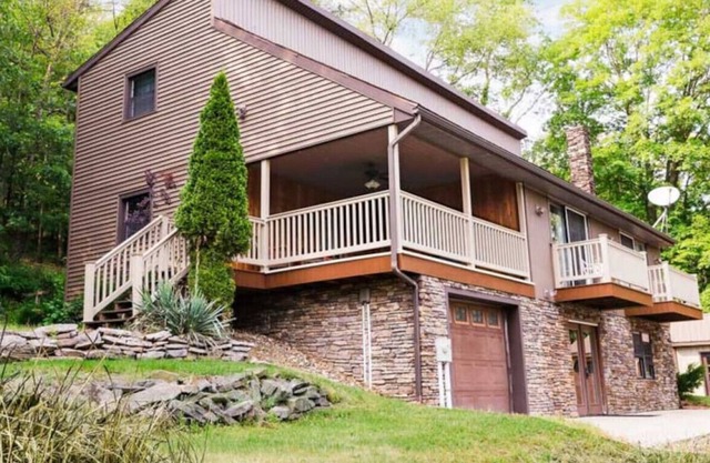 Relax in this 4 bedroom, 2 bath cabin with a fireplace!