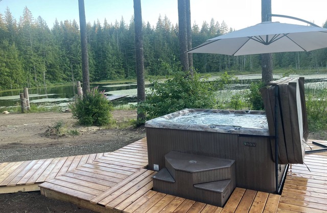Mountain retreat on a private lake with a hot tub and more!