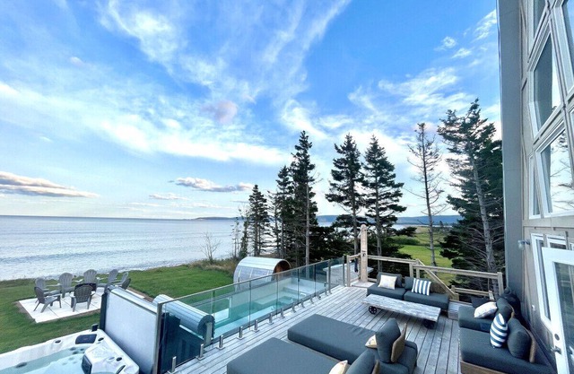 Mystical Beachfront Chalet , Hot tub , Sauna and Heated Container Pool.