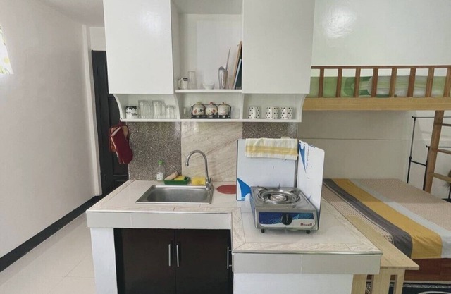 Near white-sand beaches! Studio type w/ A/C & kitchen @ Talikud Island.
