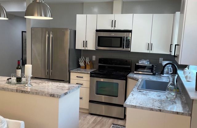New 2 bedroom suite with private parking and entrance steps away from beach