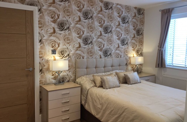 New Forest Barton-on-Sea acantilado, planta baja, apartamento con jardín. 'Bayside'.
