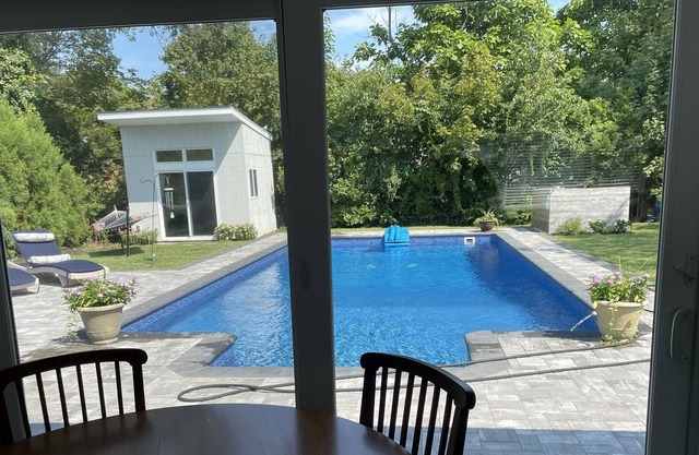 NEW LISTING Walk to the Bay Newly Renovated Home with Heated Saltwater Pool