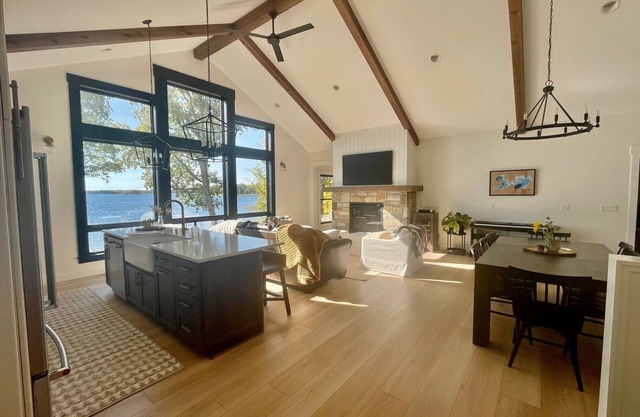 New modern lake home on 5 acres with 300 ft sandy lakeshore