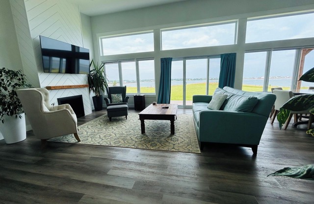 New Waterfront Modern Home with 180 degree views over Rustico Bay!