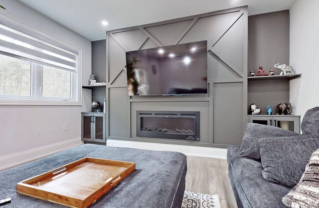 Newly renovated luxury Home with deck, surrounded by trees on a 5 acres land