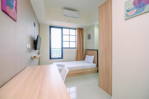 Nice 2BR at 26th Floor Evenciio Margonda Apartment By Travelio