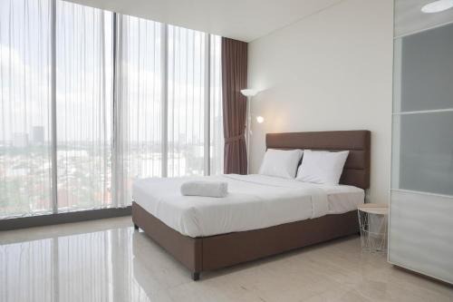 Nice and Elegant 1BR at L'avenue Pancoran Apartment By Travelio