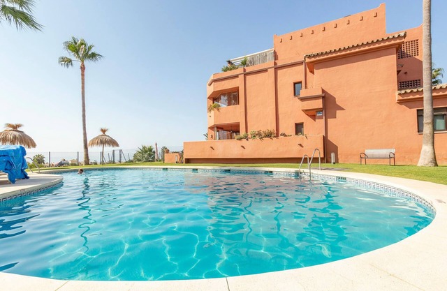 Nice vacation apartment with veranda and private garden and access to shared pool