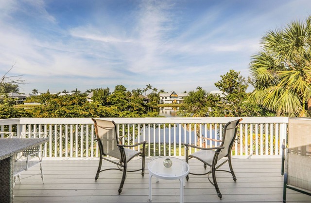 Nicely updated Sanibel duplex home located in The Dunes with lake view.