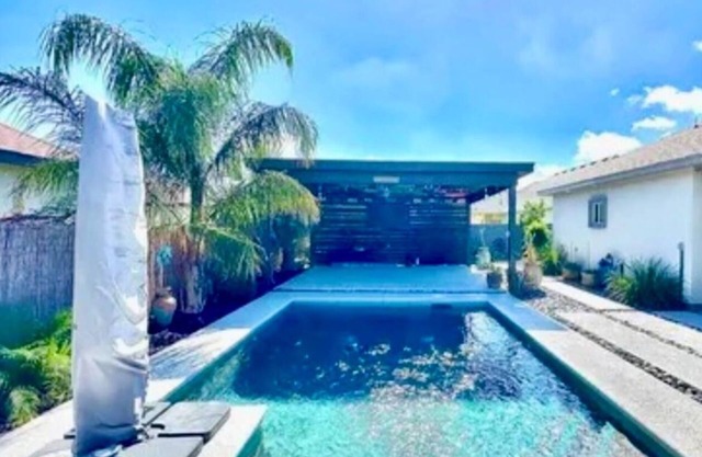 North Brownsville home with pool and pergola. Beautiful backyard oasis feeling.