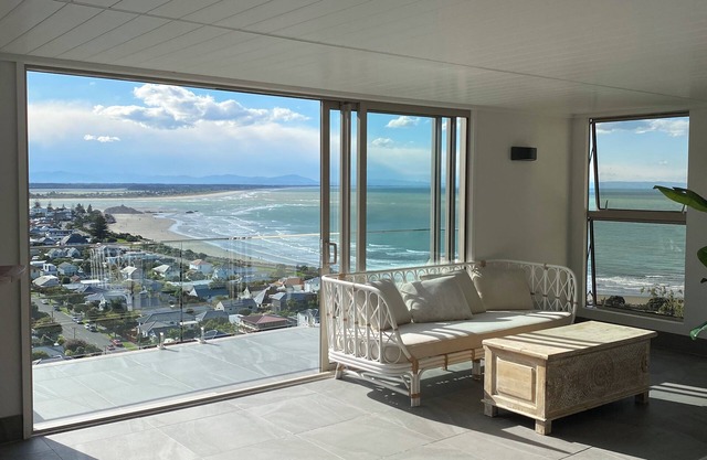 Ocean-view escape: 4 bedrooms, heated pool, sauna, and expansive terraces
