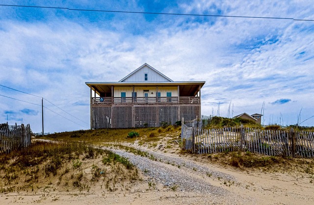 Ocean-view home with wrap-around deck, beach access, outdoor shower & cornhole