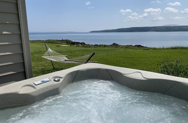 Oceanfront cabin with private beach and hot tub