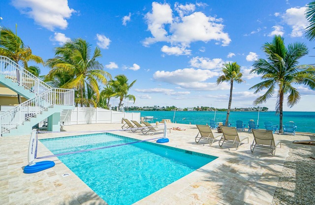 Oceanfront PARADISE w Heated pool, 55’ dock, ocean view & bathroom in every room