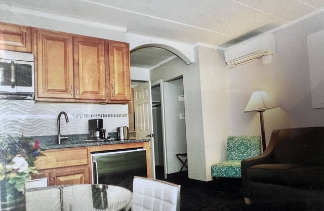 Oceanfront Property Suite Kitchenette with a Private Bedroom and a Queen Bed