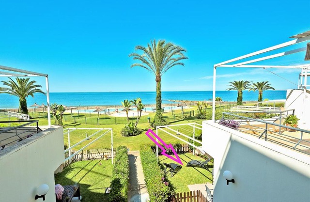 On Beach Deluxe Apartment with Pools and own Garden