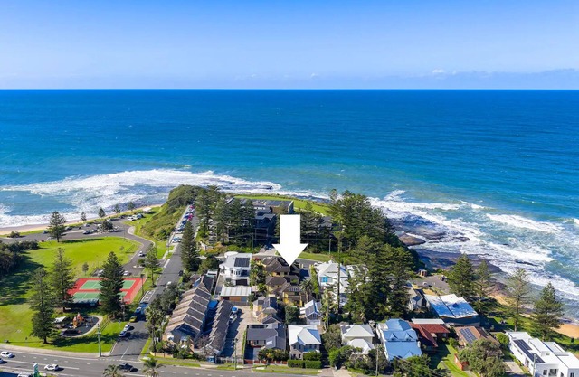 On little Austinmer beach encircled by resturants to surf,swim,fish, boat or ski