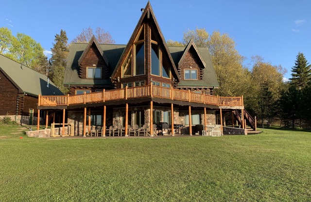 One of a kind family retreat: lake front access, hot tub, sauna, and game room.