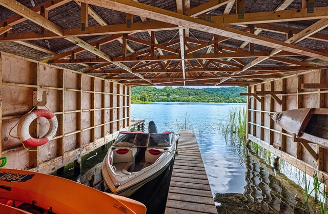 LAKE TARAWERA WITH JETTY AND BOAT SHED