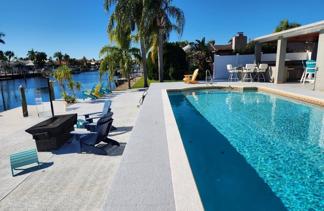 Outdoor lovers dream home- Pool, outdoor kitchen, private dock, and so much more
