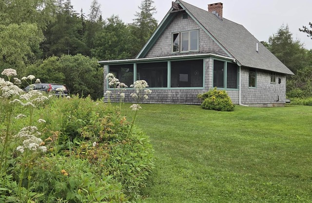 Peaceful coastal cabin with screened porch views of the cove, meadow, and sea