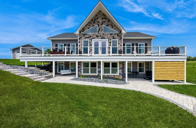 Peaceful retreat with hot tub, fire pit, games, kayaks, and water view