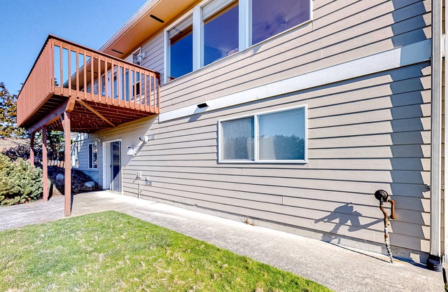 Peek-a-boo ocean view home with in-law suite, fireplace, & outdoor space