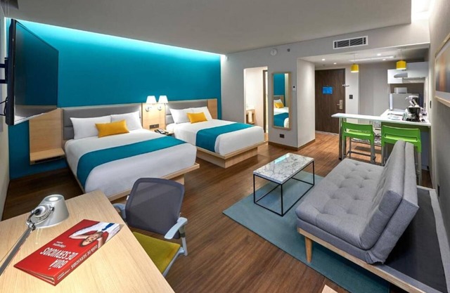 Perfect for Groups: 2-Room Stay Near Airport + Pool, Free Shuttle & Breakfast