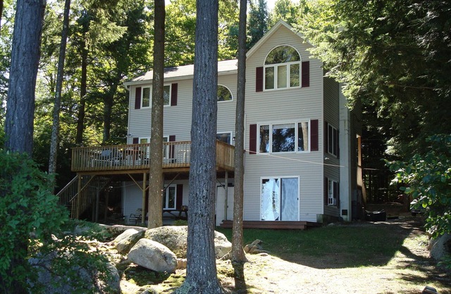 Pet-friendly home with stunning views and a large sandy beach on Sebago Lake!