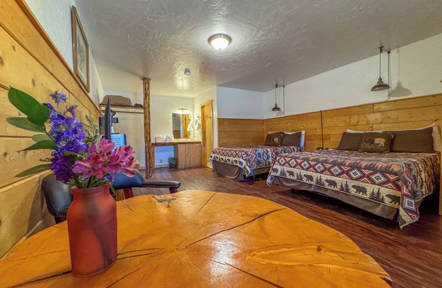 Escape to a Premium Double Queen Room with Gorgeous Riverfront Access and Panoramic Mountain Views