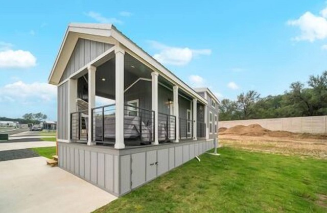 Pet-Friendly Tiny Home 'Neon Moon' Features Hill Country Views with Front Porch Fireplace and Wine C